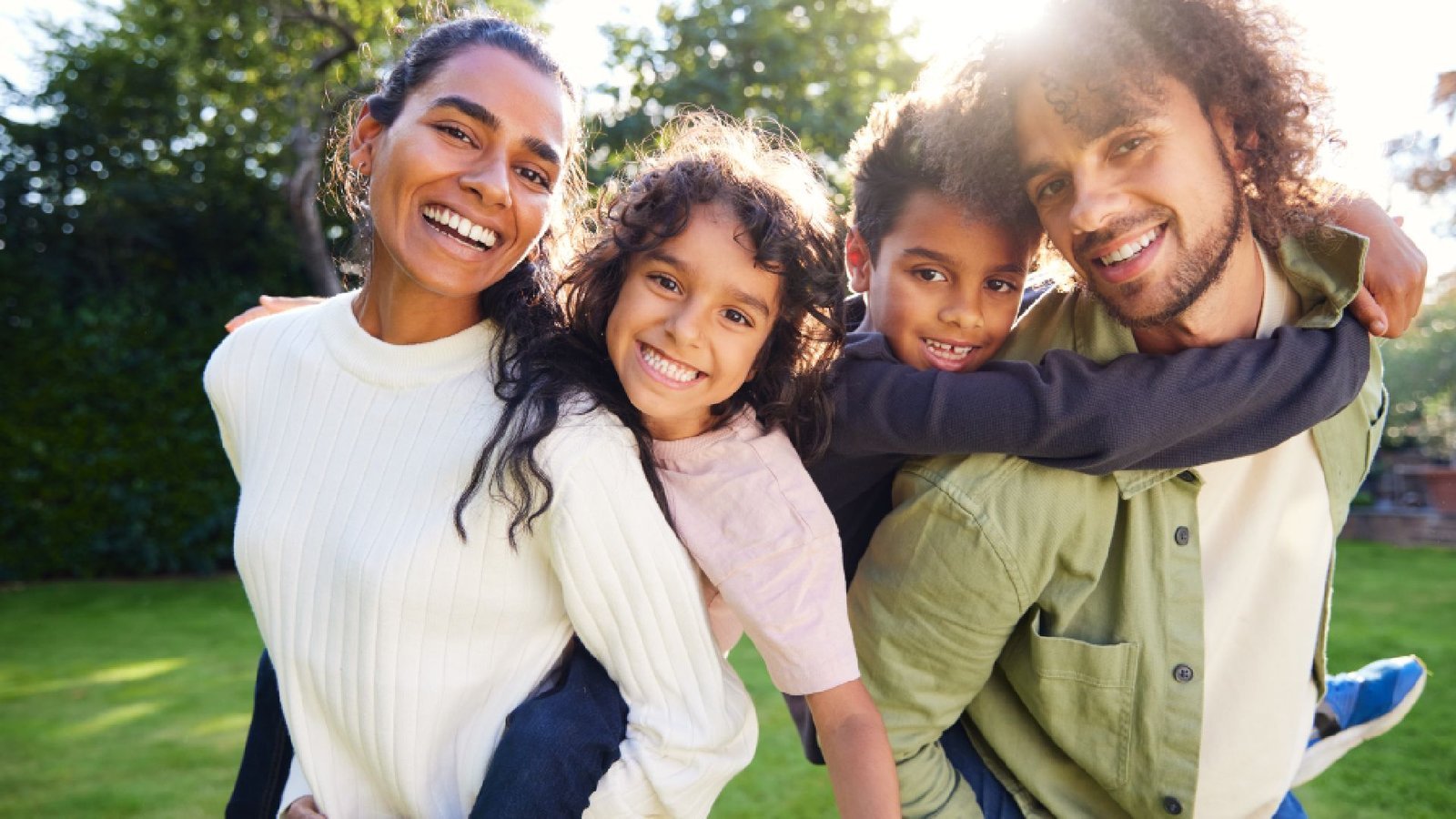 Smiling family outdoors